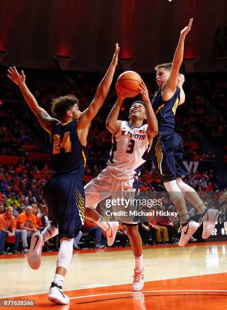 Te'Jon Lucas of the Illinois Fighting Illini shoots the ball against Pierson Wofford of the Augustana-Illinois Vikings at State Farm Center on...