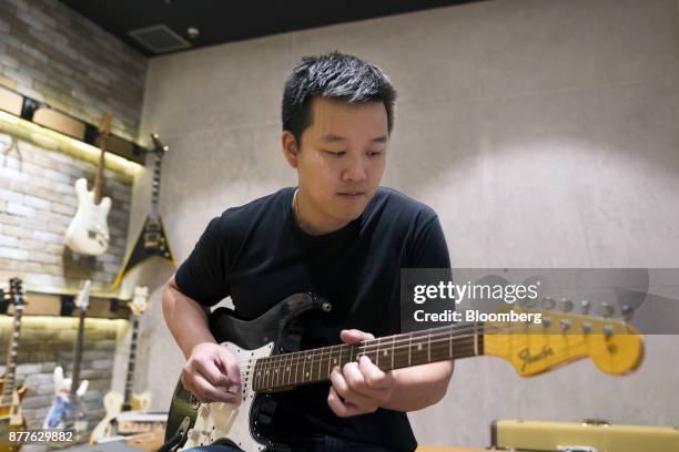 Kuok Meng Ru, founder of Bandlab Technologies Ltd., plays guitar during an interview in Singapore, on Wednesday, Nov. 22, 2017. Kuok said he wants to...