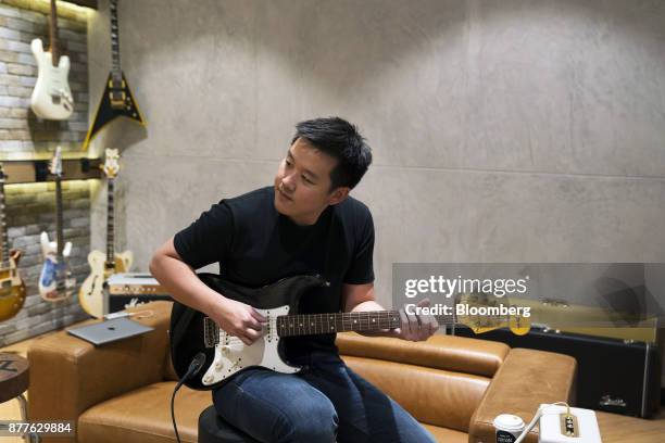 Kuok Meng Ru, founder of Bandlab Technologies Ltd., plays guitar during an interview in Singapore, on Wednesday, Nov. 22, 2017. Kuok said he wants to...