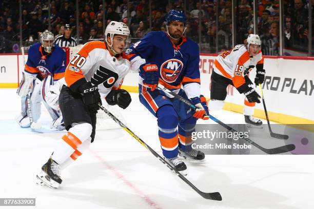 Danick Martel of the Philadelphia Flyers skates against Dennis Seidenberg of the New York Islanders in his first NHL game at Barclays Center on...