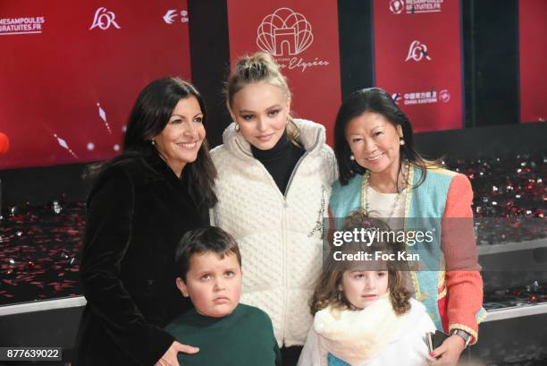 Paris Mayor Anne Hidalgo, Lily Rose Depp, kids from 'Les Petits Princes' Children care association and Jeanne d'Hauteserre attend Christmas Lights...