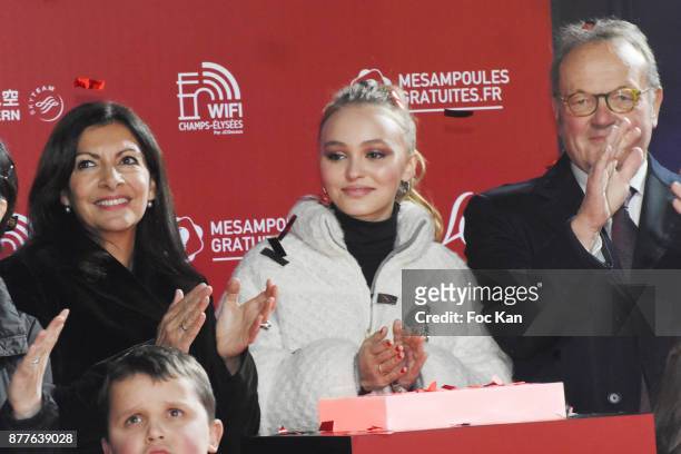 Paris Mayor Anne Hidalgo, Lily Rose Depp and Jean Noel Reinhardt President of Champs Elysees Comiteeattend Christmas Lights Launch On The Champs...