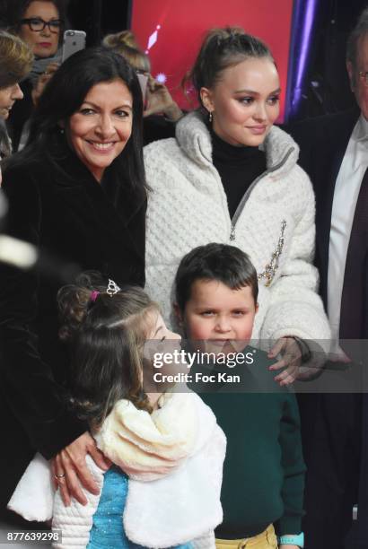 Paris Mayor Anne Hidalgo, Lily Rose Depp, kids from 'Les Petits Princes' Children care association and Jean Noel Reinhardt President of Champs...