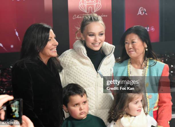 Paris Mayor Anne Hidalgo, Lily Rose Depp, kids from 'Les Petits Princes' Children care association and Jeanne d'Hauteserre attend Christmas Lights...