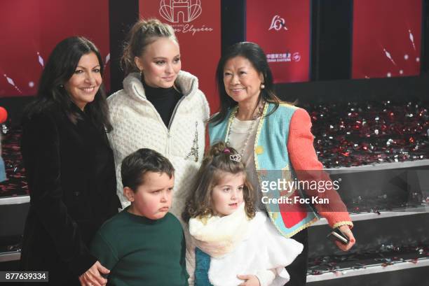 Paris Mayor Anne Hidalgo, Lily Rose Depp, kids from 'Les Petits Princes' Children care association and Jeanne d'Hauteserre attend Christmas Lights...