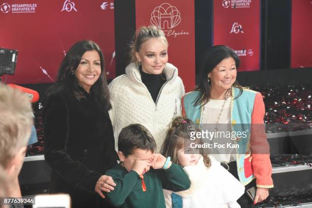 Paris Mayor Anne Hidalgo, Lily Rose Depp, kids from 'Les Petits Princes' Children care association and Jeanne d'Hauteserre attend Christmas Lights...