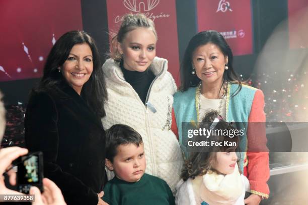 Paris Mayor Anne Hidalgo, Lily Rose Depp, kids from 'Les Petits Princes' Children care association and Jeanne d'Hauteserre attend Christmas Lights...