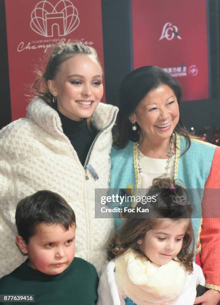 Lily Rose Depp and mayor of 8th district of Paris Jeanne d'Hauteserre attend Christmas Lights Launch On The Champs Elysees on November 22, 2017 in...