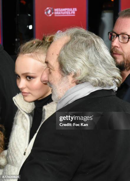 Lily Rose Depp and his escort attend Christmas Lights Launch On The Champs Elysees on November 22, 2017 in Paris, France.