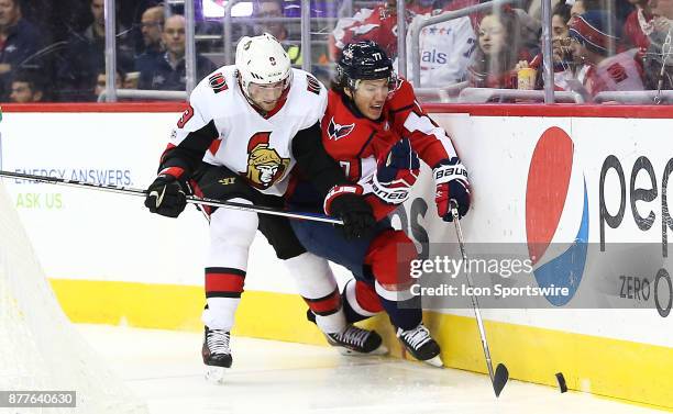 Ottawa Senators right wing Bobby Ryan checks Washington Capitals right wing T.J. Oshie into the boards during a NHL game between the Washington...