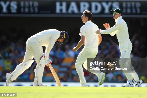 Pat Cummins of Australia celebrates after taking the wicket of Mark Stoneman of England during day one of the First Test Match of the 2017/18 Ashes...