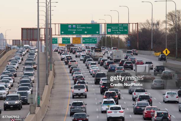 Masses of vehicles move slowly on the Montrose Ave overpass at the 1-90 Kennedy Expressway and the I-94 Edens Split the day before Thanksgiving on...