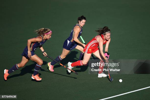 Laura Unsworth of England is put under pressure from the USA defence during their quarterfinal match in the Hockey League World Final on November 23,...