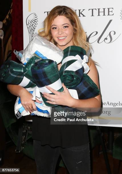 Actress Sasha Pieterse attends the stuffing of the bags for the "Thank The Angels Thanksgiving Charity" event at Lucky Strike Live on November 22,...