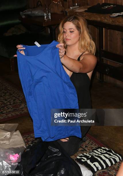 Actress Sasha Pieterse attends the stuffing of the bags for the "Thank The Angels Thanksgiving Charity" event at Lucky Strike Live on November 22,...