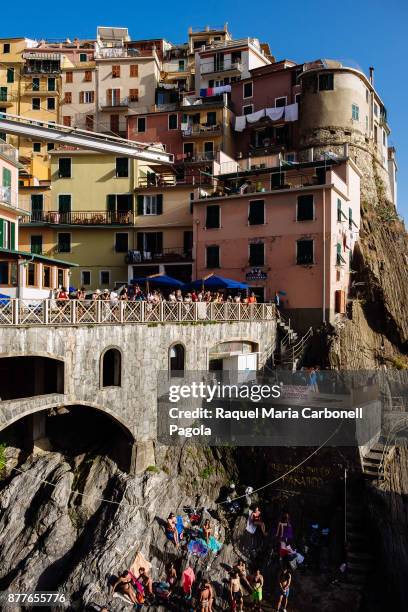 Colourful buildings on cliff side.
