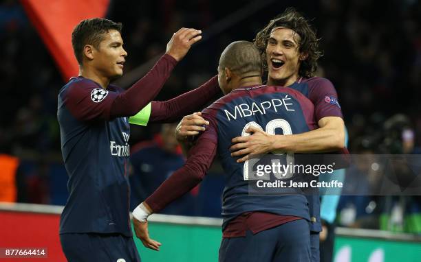 Kylian Mbappe of PSG celebrates his goal between Thiago Silva and Edinson Cavani during the UEFA Champions League group B match between Paris...