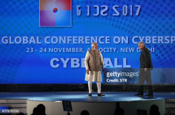 Indian Prime Minister Narendra Modi and Sri Lankan Prime Minister Ranil Wickremesinghe attend the Global Conference on Cyber Space in New Delhi on...