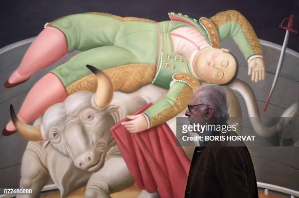 Colombian artist Fernando Botero walks on November 22 past one of his painting displayed at the Hotel de Caumont, in Aix en Provence, southern...