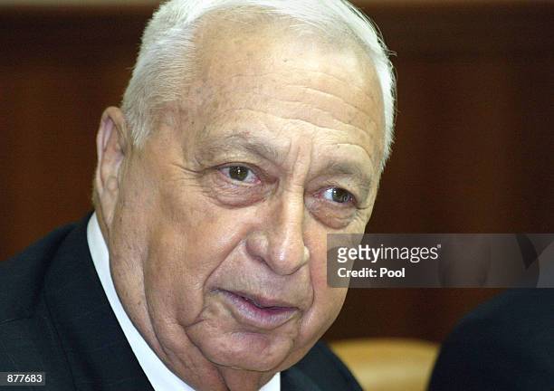 Israeli Prime Minister Ariel Sharon attends the beginning of weekly Israeli cabinet meeting June 30, 2002 in Jerusalem, Israel. Sharon and Foreign...