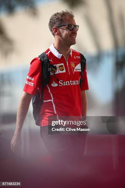 Sebastian Vettel of Germany and Ferrari walks in the Paddock during previews for the Abu Dhabi Formula One Grand Prix at Yas Marina Circuit on...