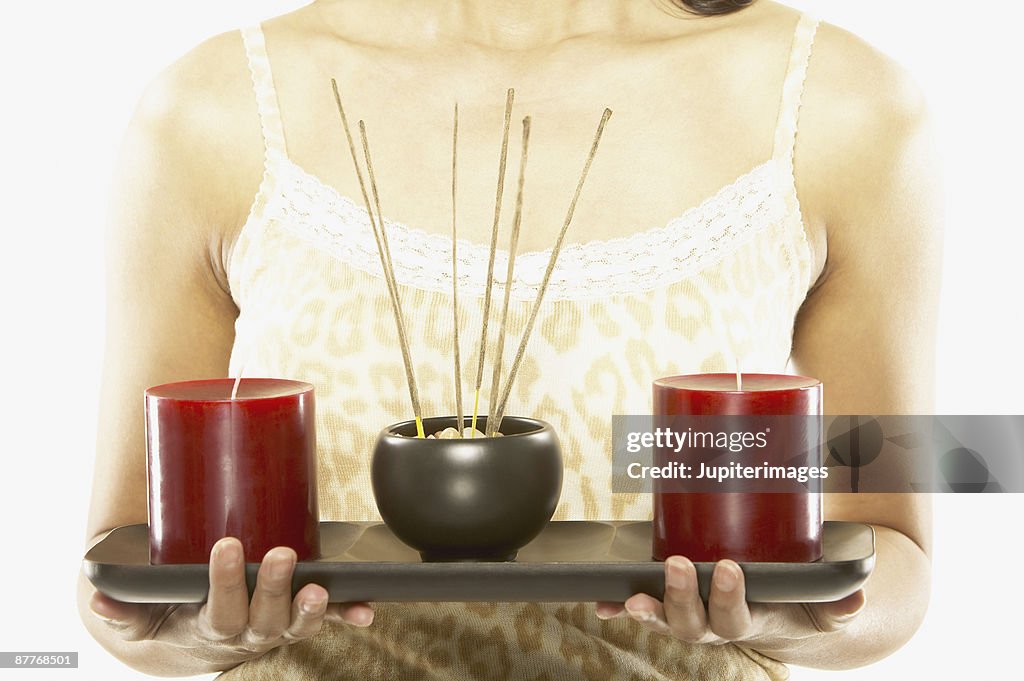 Woman with incense and candles