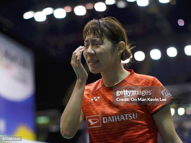 Sayaka Sato of Japan reacts after got hit by a shuttercock in the match against Akane Yamaguchi of Japan during Round 2 of Women's Single of...