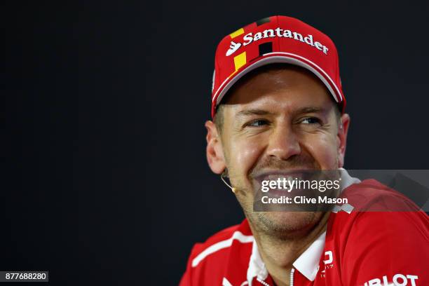 Sebastian Vettel of Germany and Ferrari smiles in the Drivers Press Conference during previews for the Abu Dhabi Formula One Grand Prix at Yas Marina...