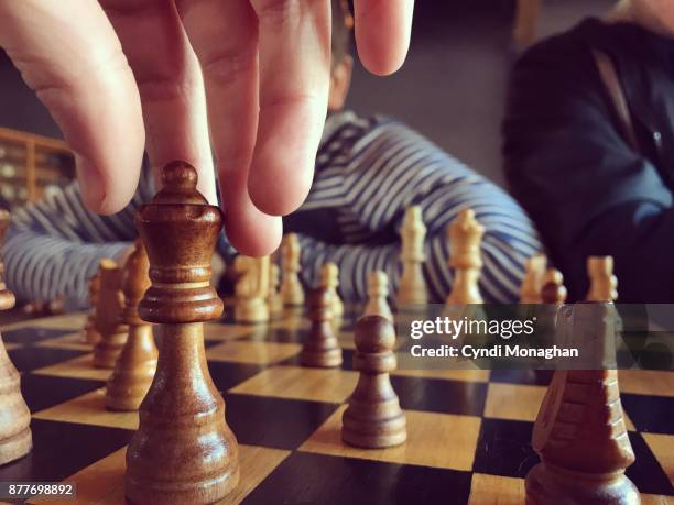 chess game with her little brother - child and unusual angle stock-fotos und bilder