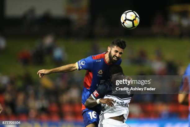 Nicholas Cowburn of the Jets contests the header against Rhys Williams of the Victory during the round eight A-League match between the Newcastle...