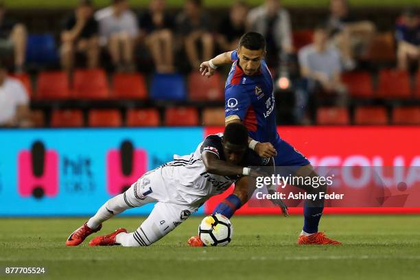 Daniel Georgievski of the Jets contests the ball against Leroy George of the Victory during the round eight A-League match between the Newcastle Jets...