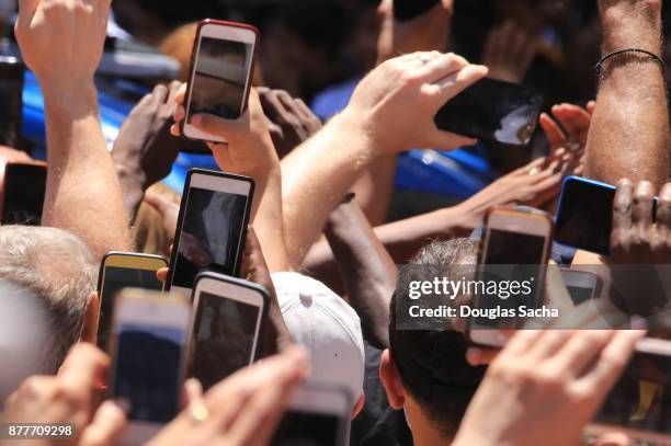 fans using smartphones at a concert - parade watchers stock pictures, royalty-free photos & images