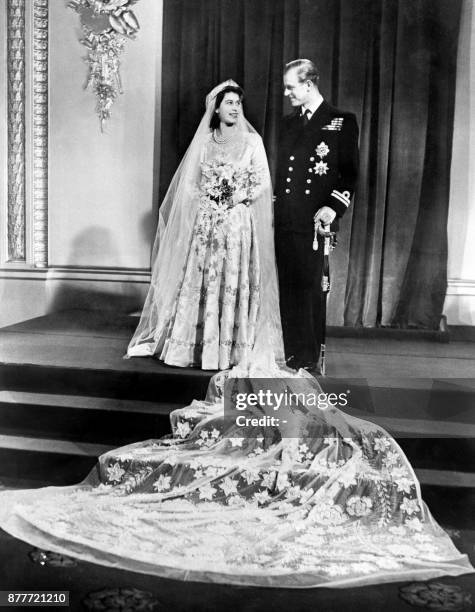 Britain's Princess Elizabeth and Philip, Duke of Edinburgh pose on their wedding day at Buckingham Palace in London on November 20, 1947.