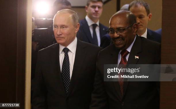 Russian President Vladimir Putin and Sudanese President Omar al-Bashir during their meeting at Black Sea resort on November 2017 in Sochi,...