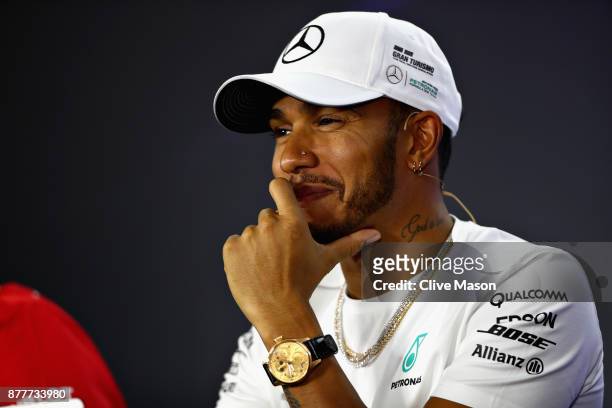 Lewis Hamilton of Great Britain and Mercedes GP smiles in the Drivers Press Conference during previews for the Abu Dhabi Formula One Grand Prix at...