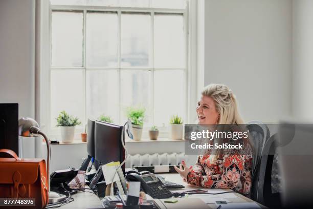 female laughing in the office - small office stock pictures, royalty-free photos & images