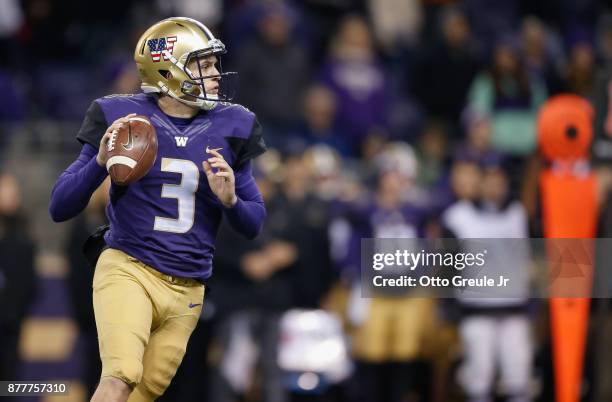 Quarterback Jake Browning of the Washington Huskies looks downfield to pass against the Utah Utes at Husky Stadium on November 18, 2017 in Seattle,...