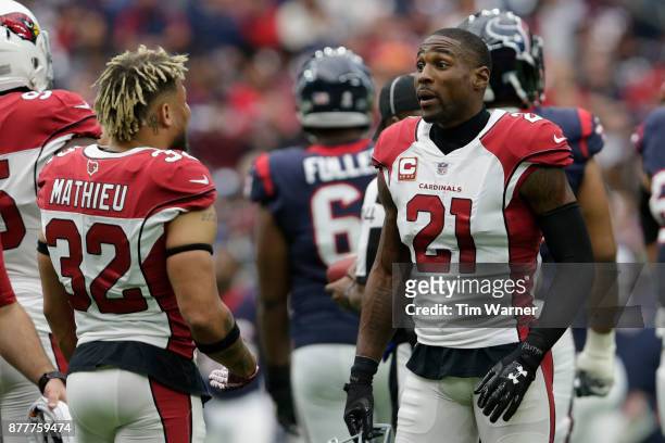 Patrick Peterson of the Arizona Cardinals talks with Tyrann Mathieu during a review in the first half against the Houston Texans at NRG Stadium on...