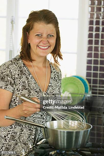 a woman cooking sweden. - wife beater stock pictures, royalty-free photos & images