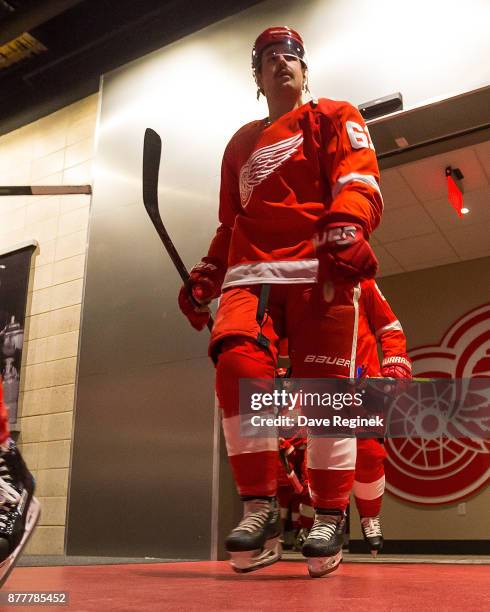 Xavier Ouellet of the Detroit Red Wings heads out to the rink for warm ups prior to an NHL game against the Colorado Avalanche at Little Caesars...