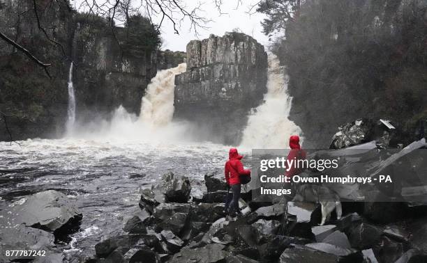 Walkers at the High Force Waterfall on the River Tees near Middleton-in-Teesdale in the North Pennines.