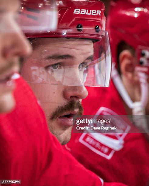 Xavier Ouellet of the Detroit Red Wings watches the action from the bench against the Colorado Avalanche during an NHL game at Little Caesars Arena...