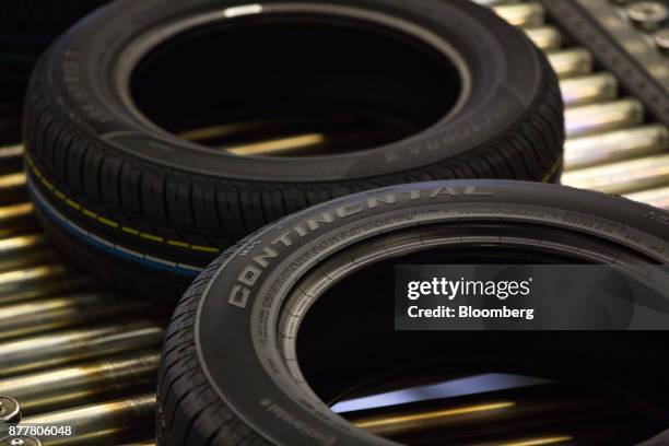 Automobile tires pass along a conveyor belt at the Continental AG tire plant in Kaluga, Russia, on Wednesday, Nov. 22, 2017. The strong outlook for...