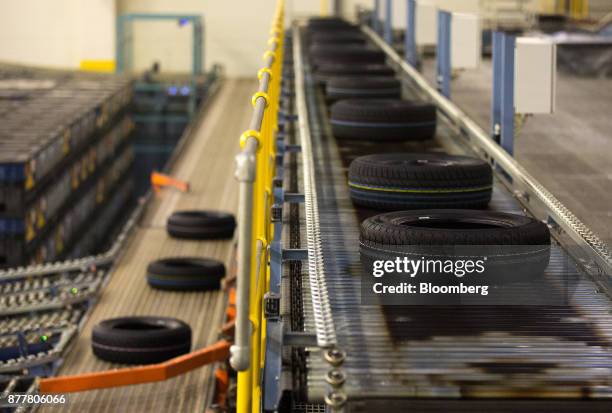 Automobile tires pass along a conveyor belt at the Continental AG tire plant in Kaluga, Russia, on Wednesday, Nov. 22, 2017. The strong outlook for...