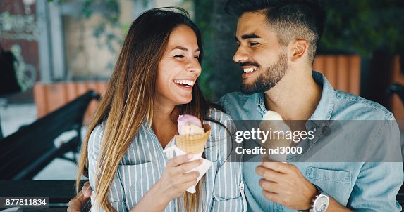 Happy couple having date and eating ice cream Happy couple having date and eating ice cream