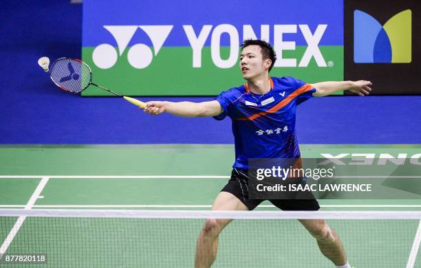 Taiwan's Tzu Wei Wang hits a shot against China's Chen Long during their quarterfinal men's singles match at the Hong Kong Open badminton tournament...