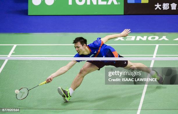Taiwan's Tzu Wei Wang hits a shot against China's Chen Long during their quarterfinal men's singles match at the Hong Kong Open badminton tournament...