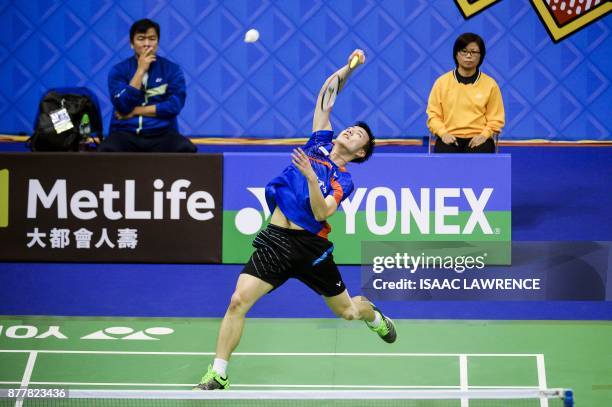 Taiwan's Tzu Wei Wang hits a shot against China's Chen Long during their quarterfinal men's singles match at the Hong Kong Open badminton tournament...