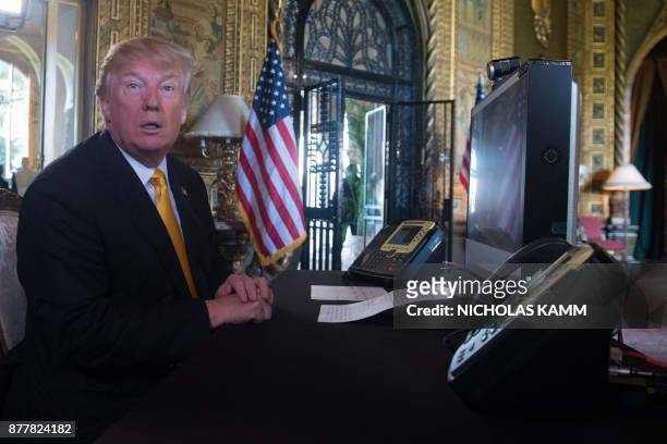 President Donald Trump prepares his traditionnal adress to thank members of the US military via video teleconference on Thanksgiving day, November...