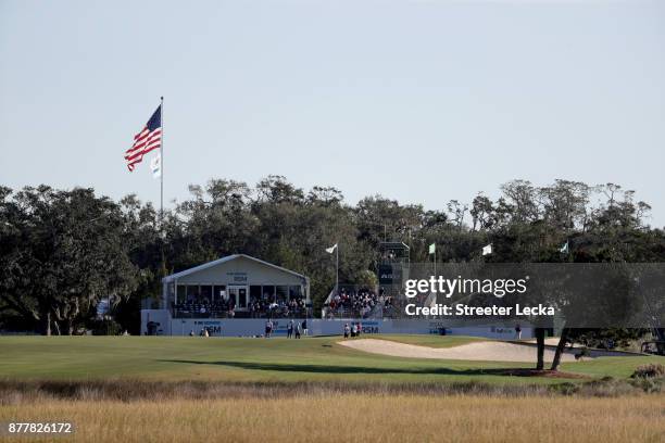 Brian Harman of the United States, Stephan Jaeger of Germany and Ted Potter jr. Of the United States stand on the 18th green during the final round...